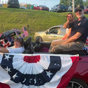 Alan Bradstock and Lois Bower-Bjornson riding in the Jacktown Fair opening day parade